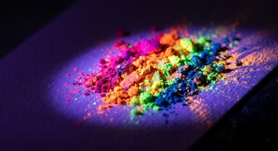 UV pigment showing bright colors under blacklight on white surface
