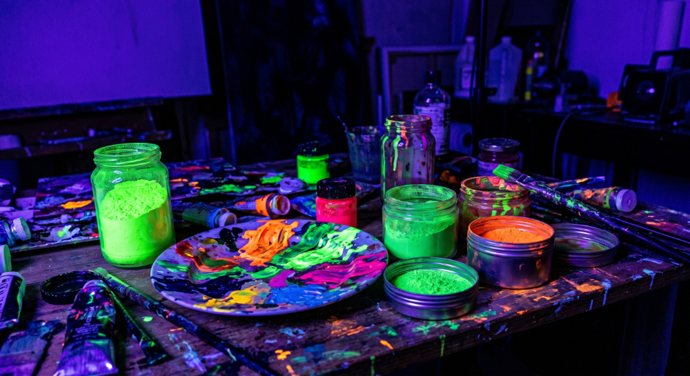 UV black lights illuminating fluorescent paints, glow powders, and neon pigments